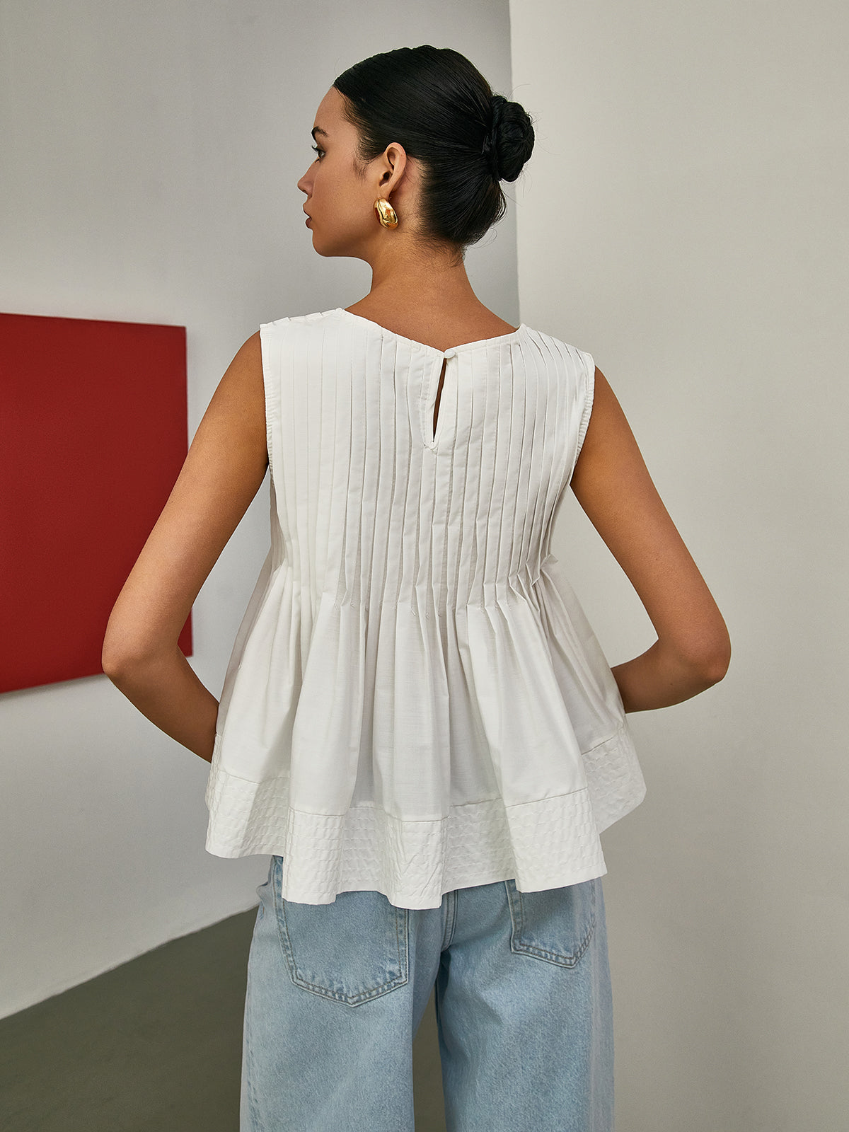 Elena - Pleated Peplum Sleeveless Blouse